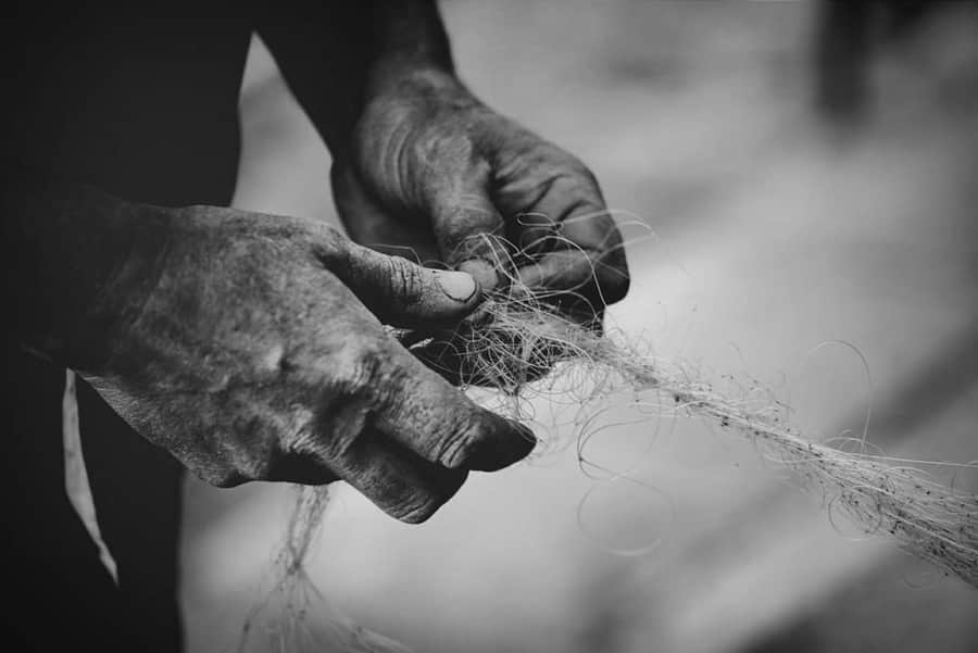 Handwork — sorting reclaimed ocean nets for bespoke superyacht furniture and sculpture art